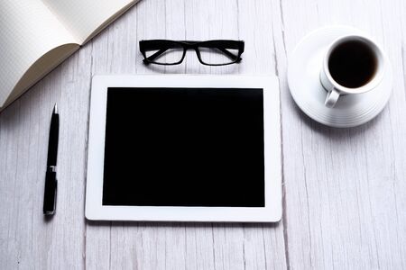 digital tablet with blank screen on wooden backgroundの写真素材