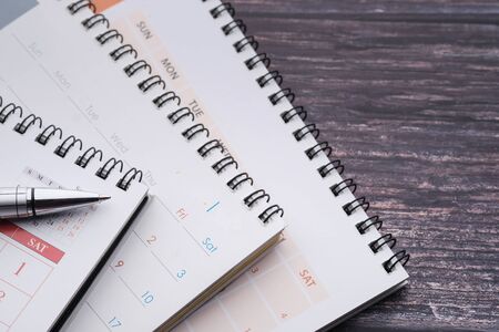 stack of calendar and pen on office deskの写真素材