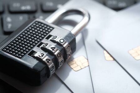 Padlock and credit cards on laptop. Internet data privacy information security conceptの写真素材