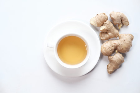 Top view of ginger tea on white background