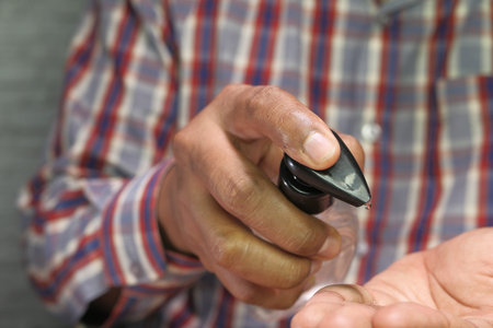 Young man using sanitizer for preventing virus, Close up