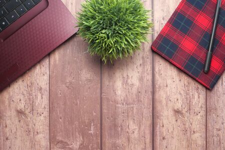 high angle view of open notepad and calculator on tableの写真素材