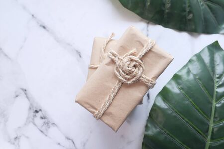 Handmade crafted paper gift boxes on wooden backgroundの写真素材