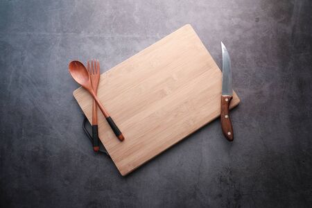 Top view of wooden chopping board on gray background .の写真素材