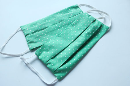 Homemade cotton Face Mask for preventing virus on white backgroundの写真素材