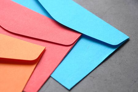 close up of colorful envelopes on tableの写真素材