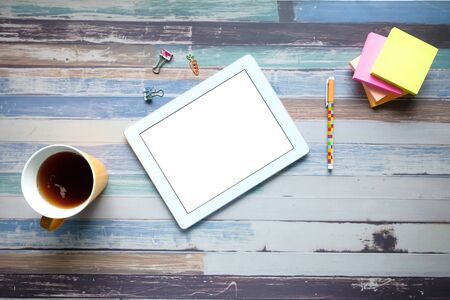 Top view of digital tablet with screen on deskの写真素材