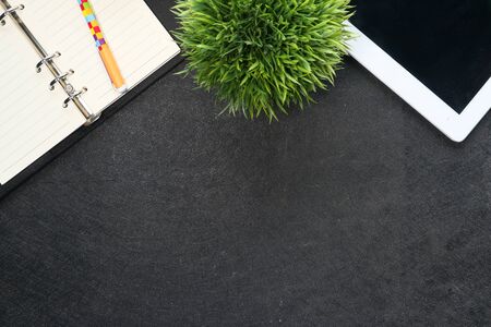 high angle view of digital tablet, notepad on back background with copy spaceの写真素材