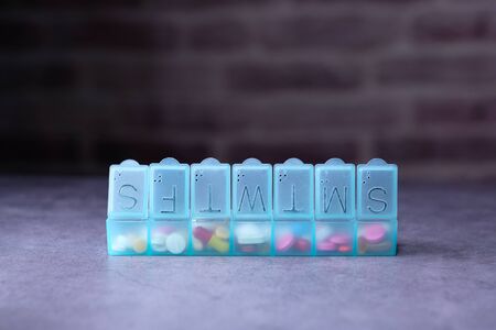 Close up of green color pill box on tableの写真素材