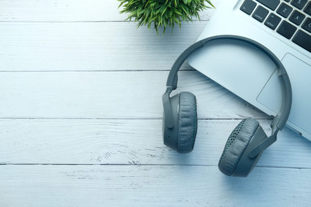 headphone on laptop with copy space on table, Top viewの写真素材