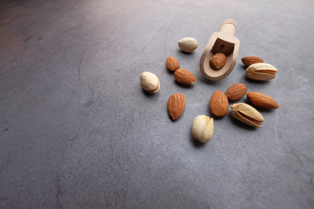 almond and pistachios nut on gray backgroundの写真素材