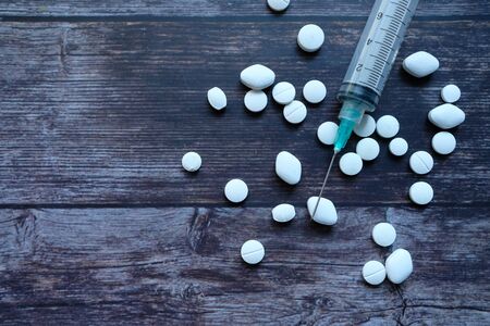 syringe and pills on gray background, Top viewの写真素材