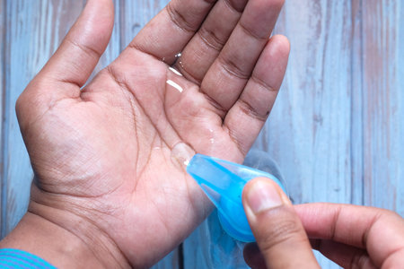 mans hands using hand sanitizer gel, healthcare and medical .