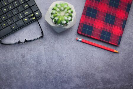 high angle view of eyeglass, notepad and keyboard with copy spaceの写真素材