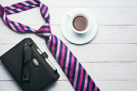 Fathers day concept. mens tie, glasses, coffee on white background top-down.の写真素材