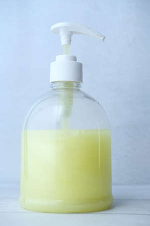 Hand washing soap bottle on table, close upの写真素材