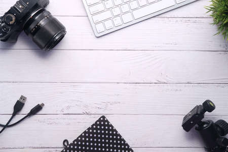 Flat lay camera and equipment on working desk.の写真素材