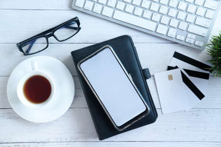 smart phone with empty screen on notepadの写真素材