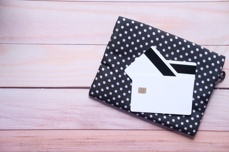 close up of credit cards on wallet on wooden background