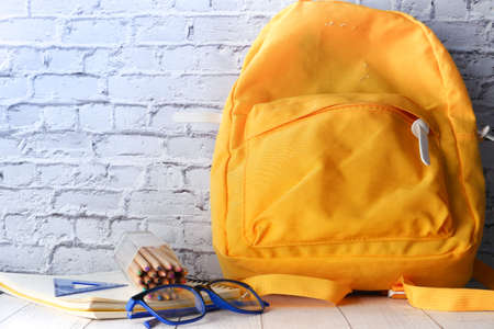Back to school concept yellow backpack on tableの写真素材