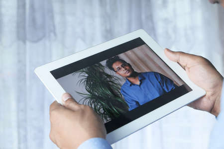 businessman working in video conference, close up.の写真素材