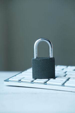 internet safety concept with padlocked on computer keyboard.