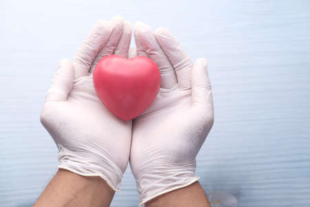 man hand with heart on white background. closeupの写真素材