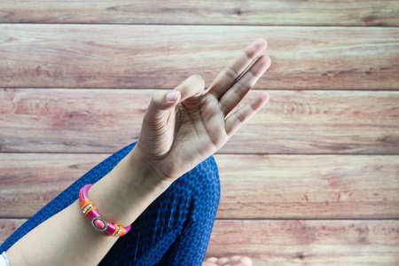 Young woman meditating in the lotus pose