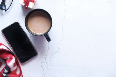 flat composition of smart phone and coffee on tableの写真素材