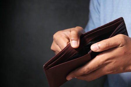 Man hand open an empty wallet with copy space.