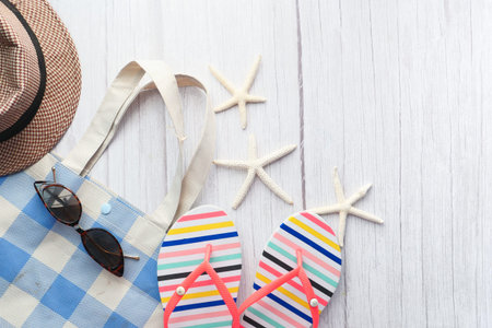 flat composition of summer beach accessories on table.