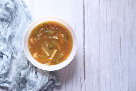chicken vegetable soup on a black backgroundの写真素材