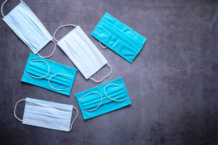 Close up of blue surgical masks on table