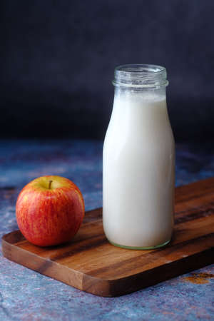 healthy snack concept with milk and apple on table.の写真素材