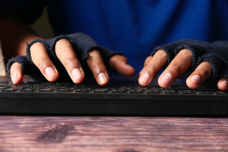 Close up of hacker hand stealing personal data