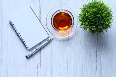 high angle view of open notepad on white backgroundの写真素材