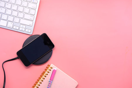 charging Smartphone Using Wireless Charging Pad, top view
