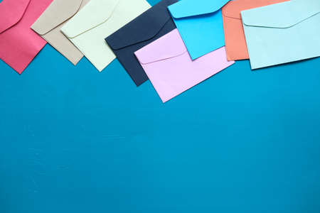 colorful envelope on green background with copy space.の写真素材