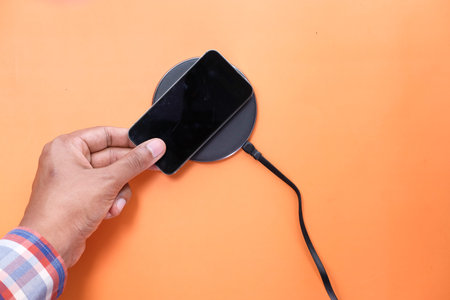 charging Smartphone Using Wireless Charging Pad, top view