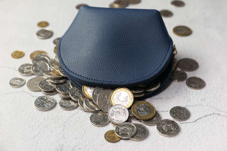 top view of coins in a small leather bagの写真素材