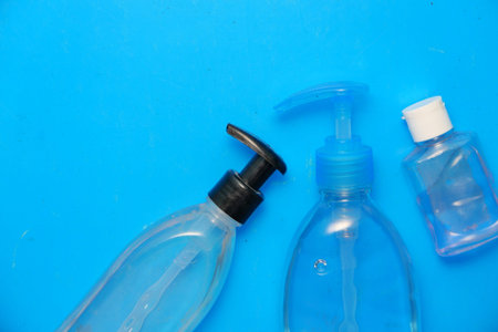 hand sanitizer gel on blue background top down