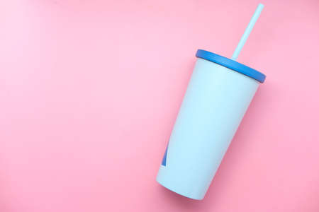 reusable eco coffee cup on pink background with copy space.の写真素材