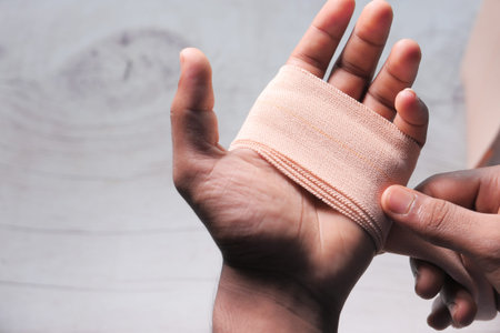 Close up of man hand with bandage