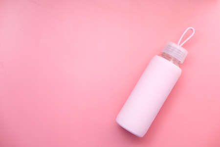 top view sport bottle isolated on pink backgroundの写真素材