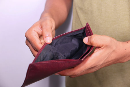 Man hand open an empty wallet with copy space.