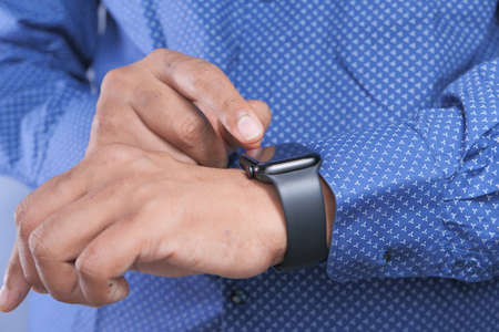 top view of mans hand using smart watch.の写真素材