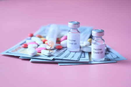 Healthcare cost concept with us dollar, vaccine and pills