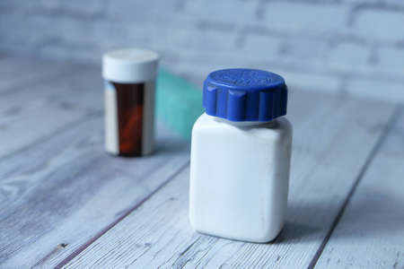 Close up of empty pill container on tableの写真素材