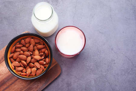 almond nut and milk on table top downの写真素材