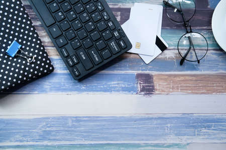 high angle view of credit cards and office stationary on tableの写真素材